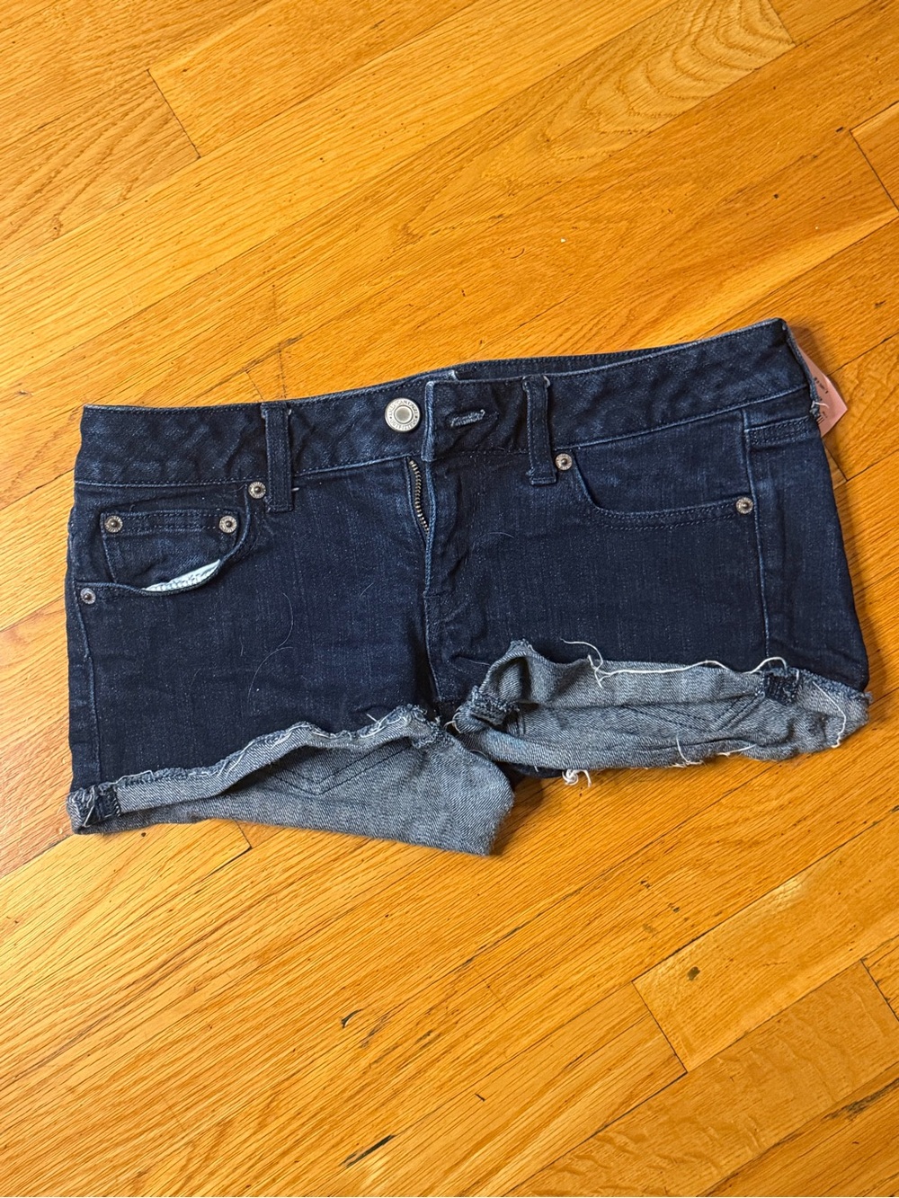 American Eagle dark-wash denim short shorts in a flattering low-rise fit.